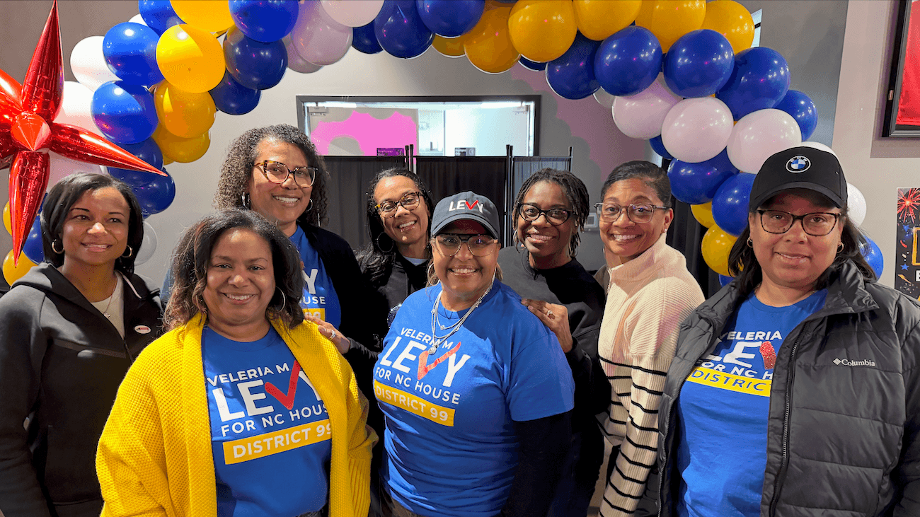 New North Carolina Project volunteers celebrate together at an event with balloons.